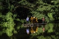 Monks come to offer alms by coming through the water by punting on bamboo rafts along the river at O Ã¢â¬â¹Ã¢â¬â¹Poi Market